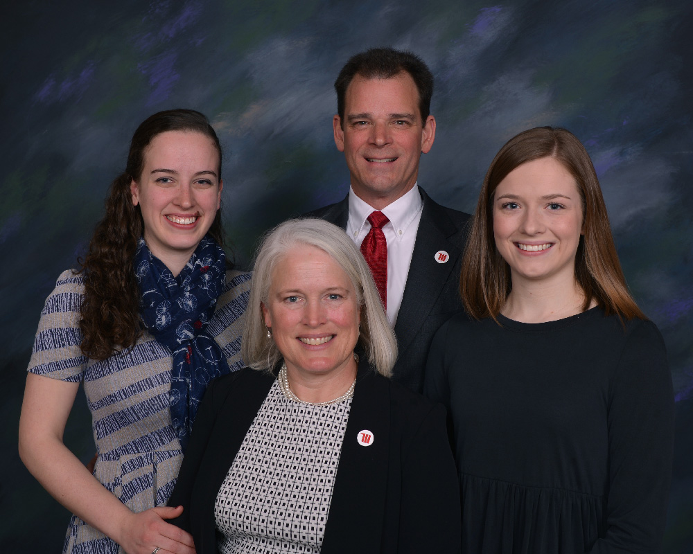 Dr. Michael Frandsen and wife Sharon, center, with daughters, Janie, left, and Kate