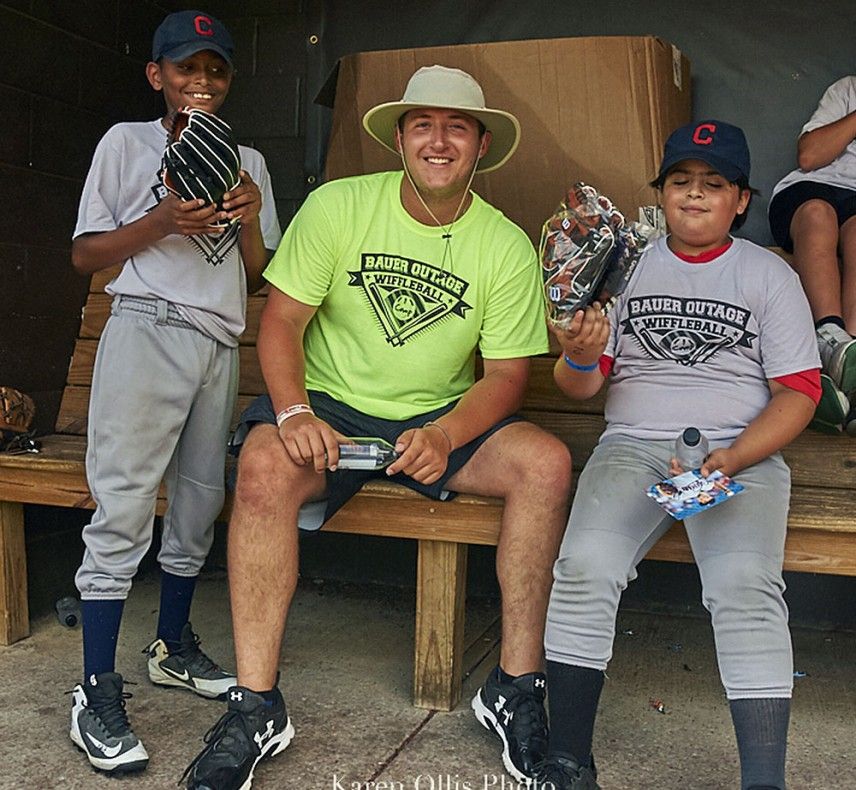 Jack Hollinshead with young baseball players