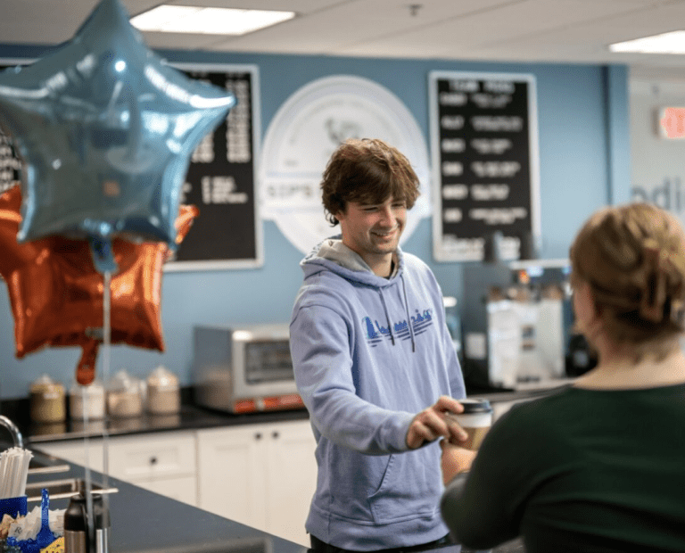 Student serving customer