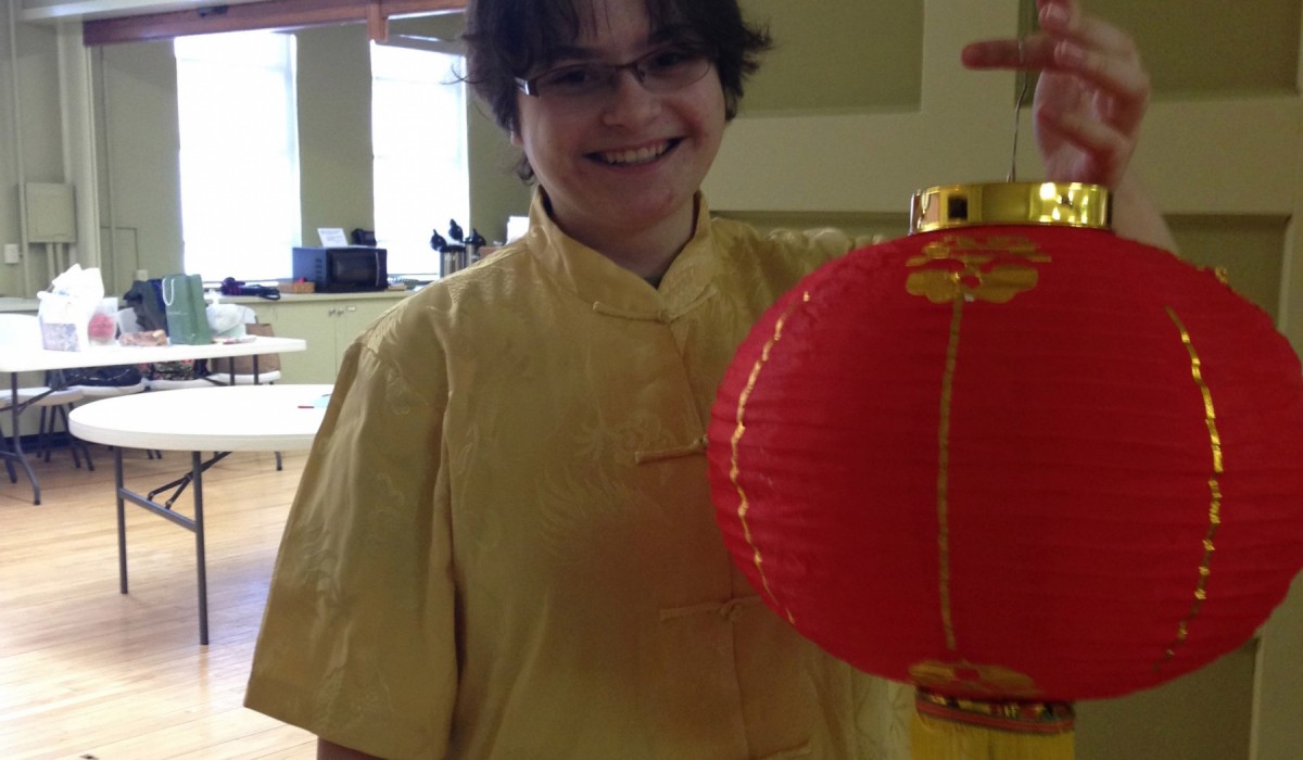 Emmaline Higgins '18 holding a Chinese Lantern