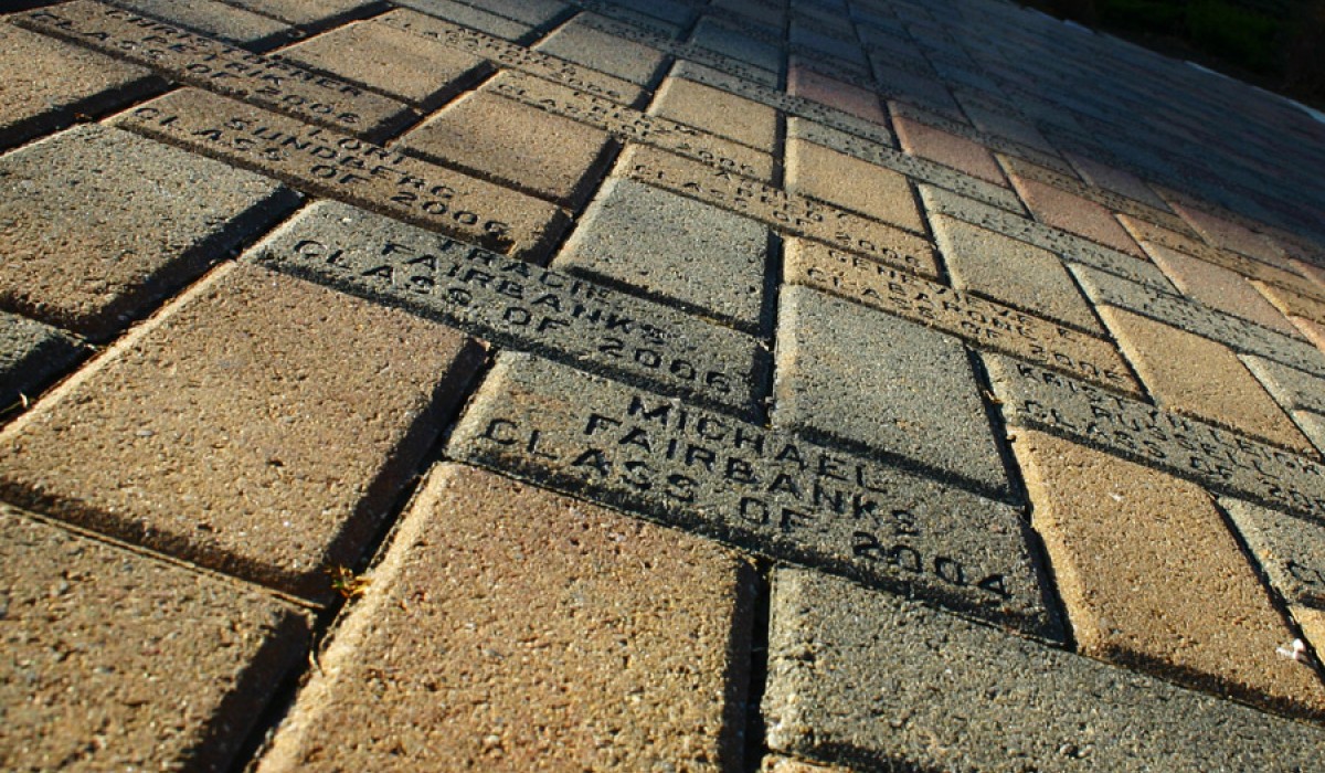 Close up view of alumni way engraved brick