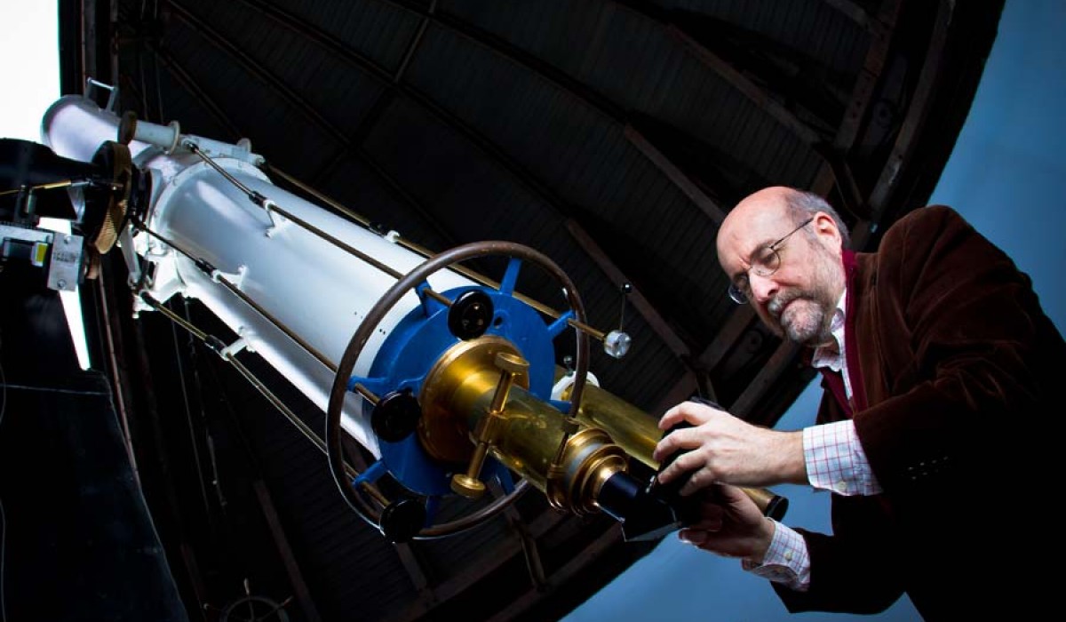 Dr. Fleisch preparing the Weaver Observatory telescope for use.