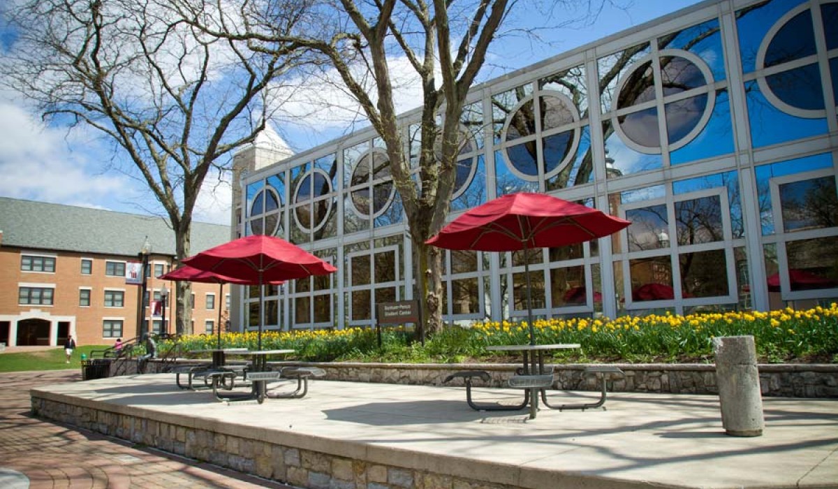 Student Center patio tables on Alumni Way