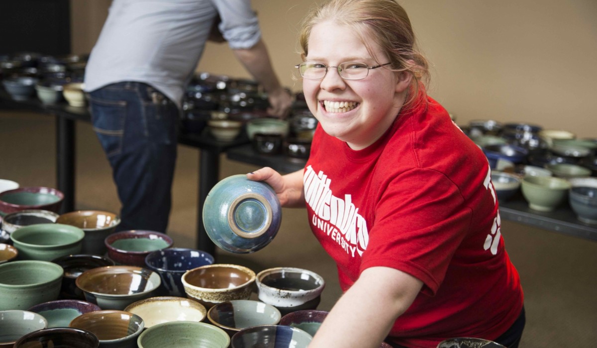Student at Empty Bowls event
