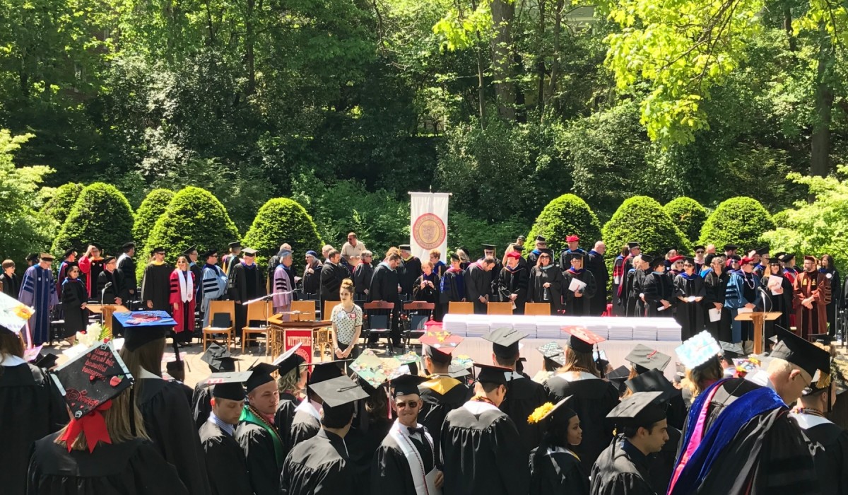 Students in caps and gowns after the ceremony