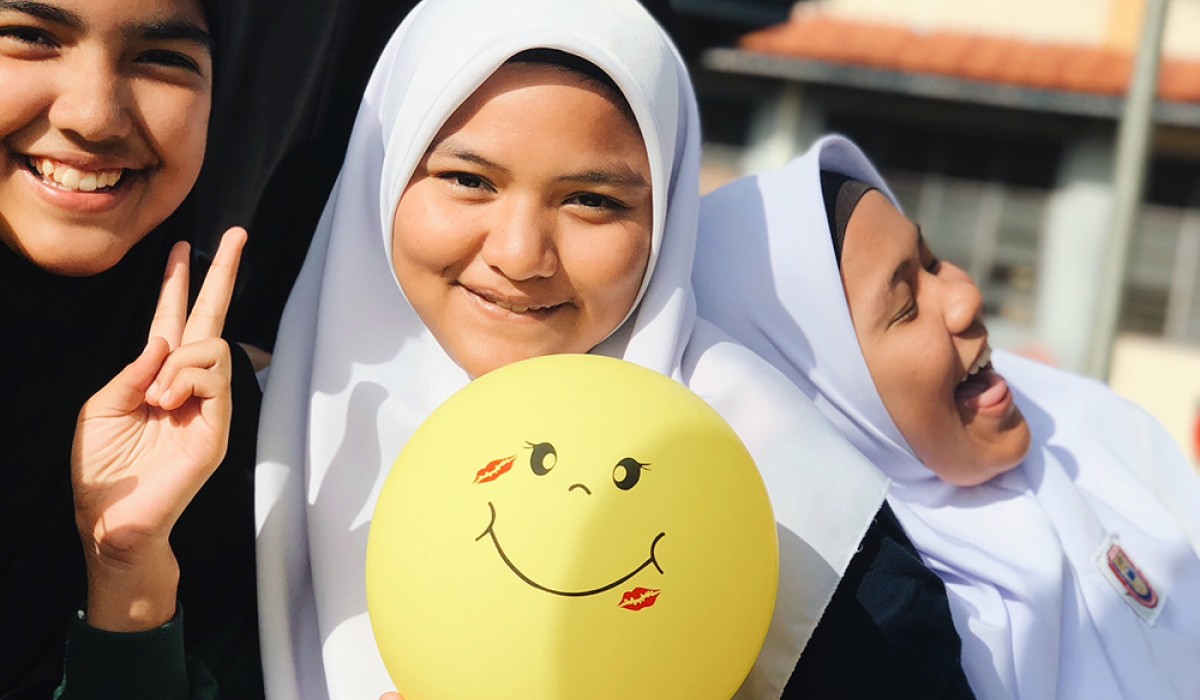 Maria Symons with her students in Malaysia