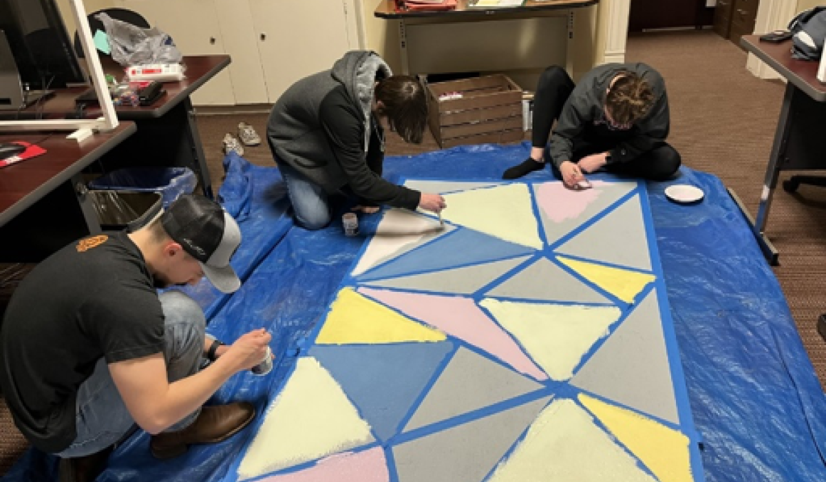 Students painting boards