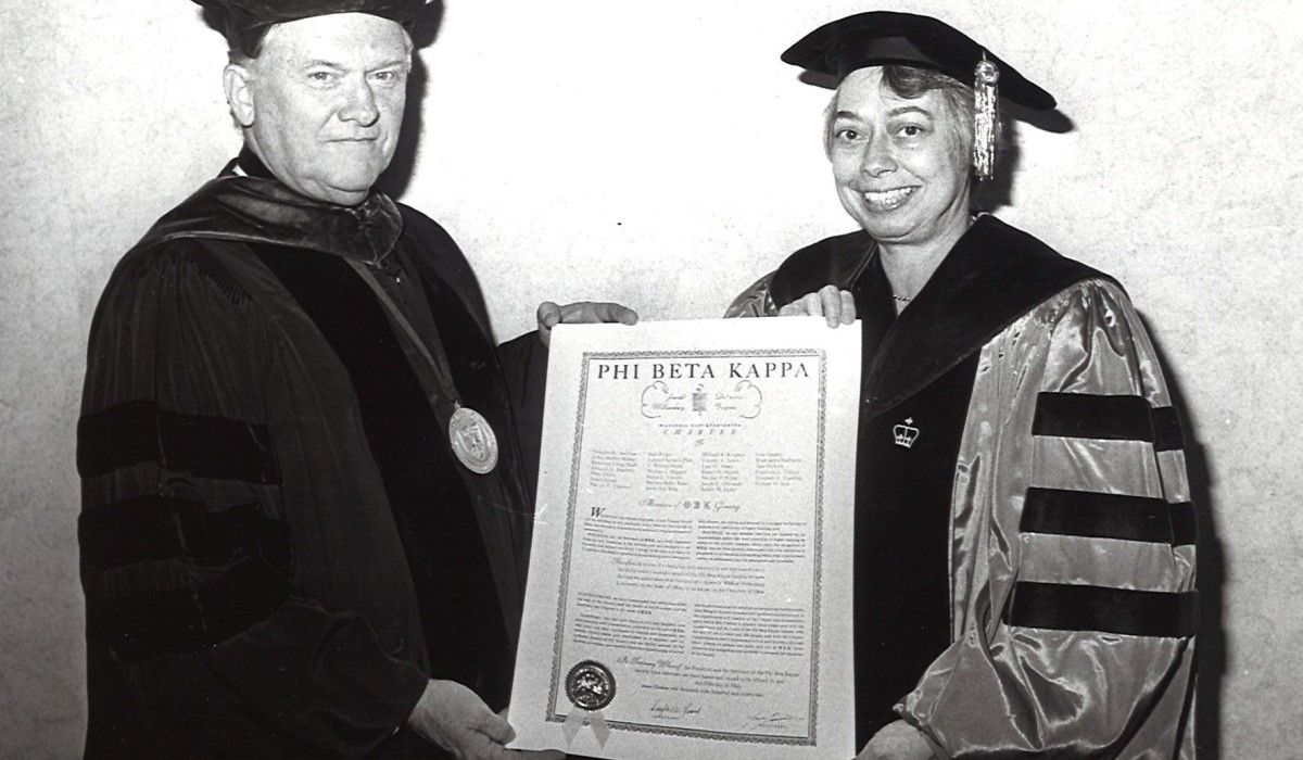 President William A. Kinnison accepts Wittenberg’s Phi Beta Kappa charter from Dr. Joan 