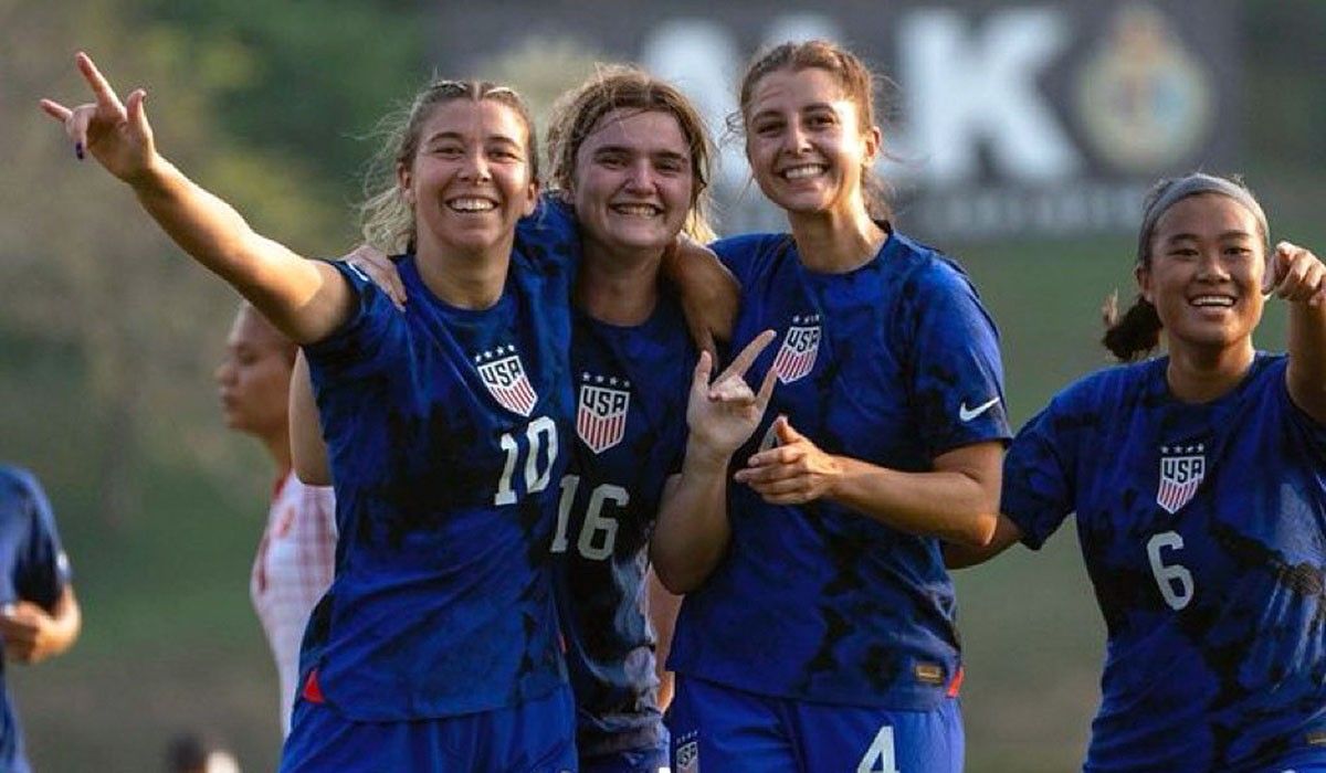 Emma Neff (16) and teammates celebrate a goal