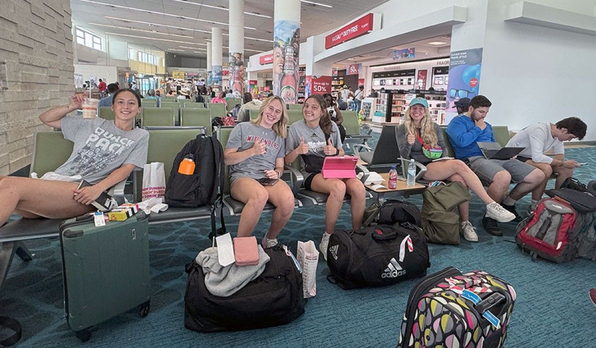 Happy students finally grabbing lunch in Nassau after a stressful morning in Charlotte