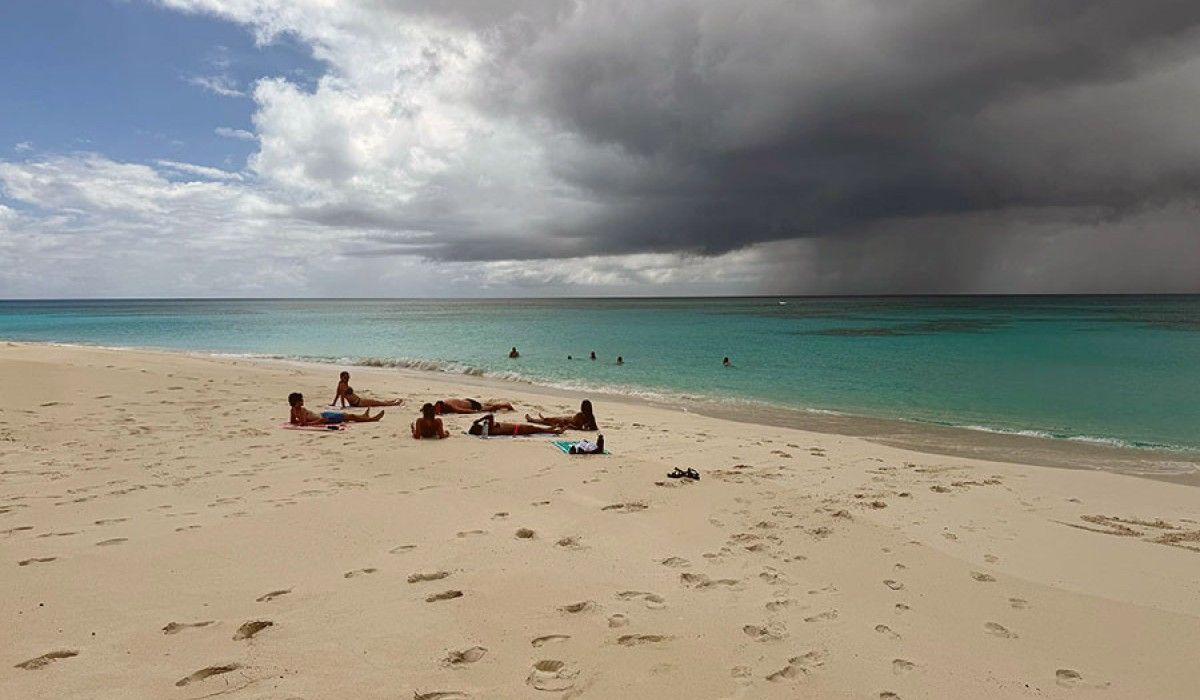 Clouds impinge on a beautiful beach day