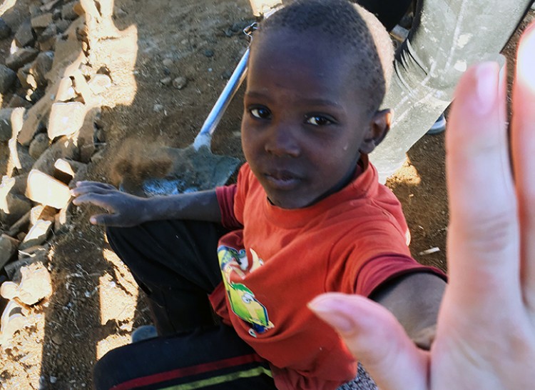 Orphan giving high five