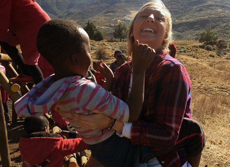 Student holding orphan