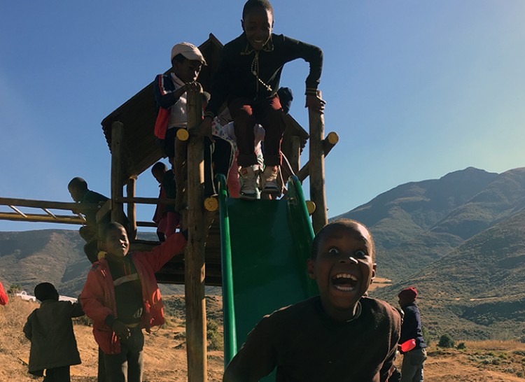 Orphans Sliding On Swing Set