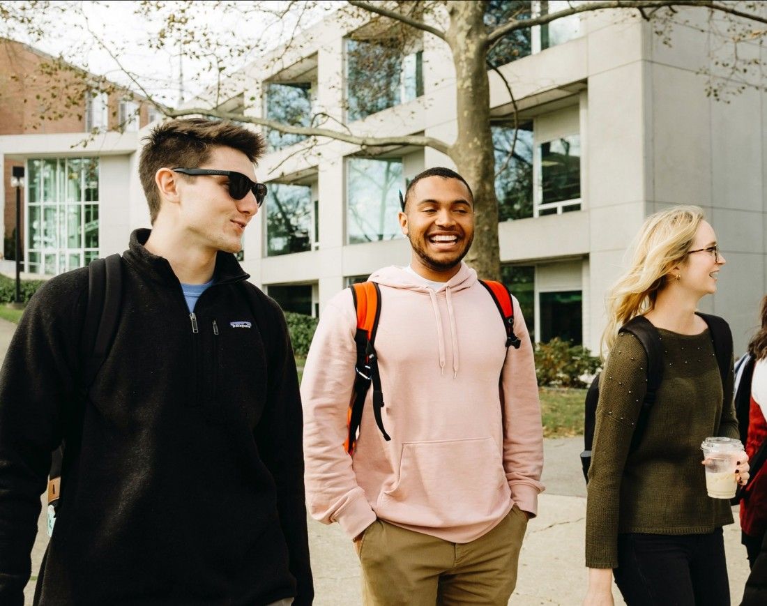 students walking by campus library
